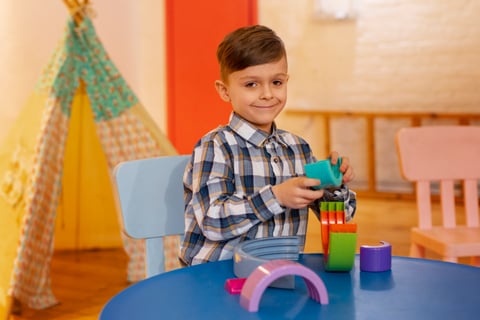 young-boy-playing-indoors-with-eco-toys